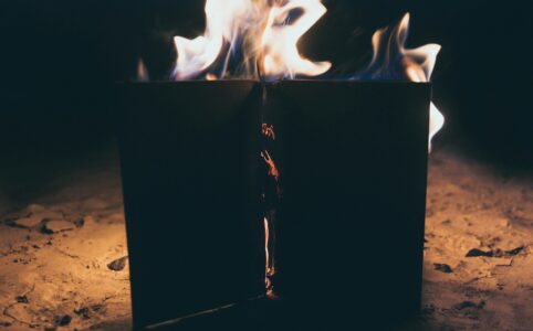 a book is standing up and actively on fire