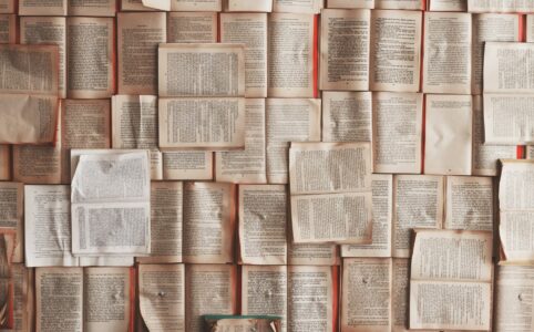 a collage of book pages covered in small print